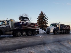 Dump truck loading snow
