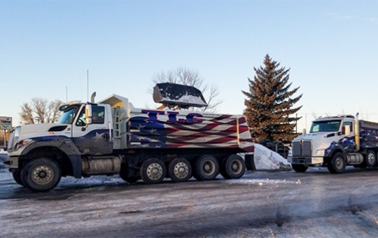 TLC Trucks Loading Snow