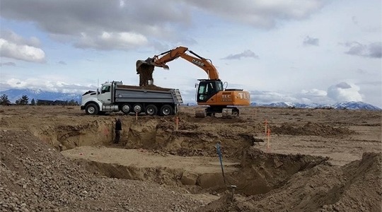 Excavator Loading a Dump Truck